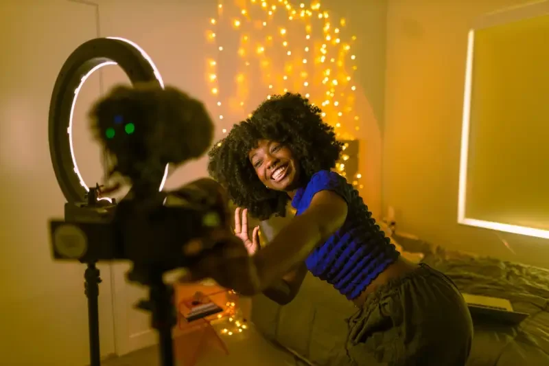 A content creator making a video. Image from CanvaPro.