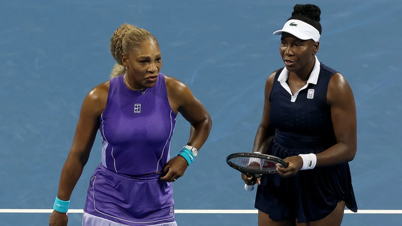 Serena Williams and Venus Williams playing tennis together