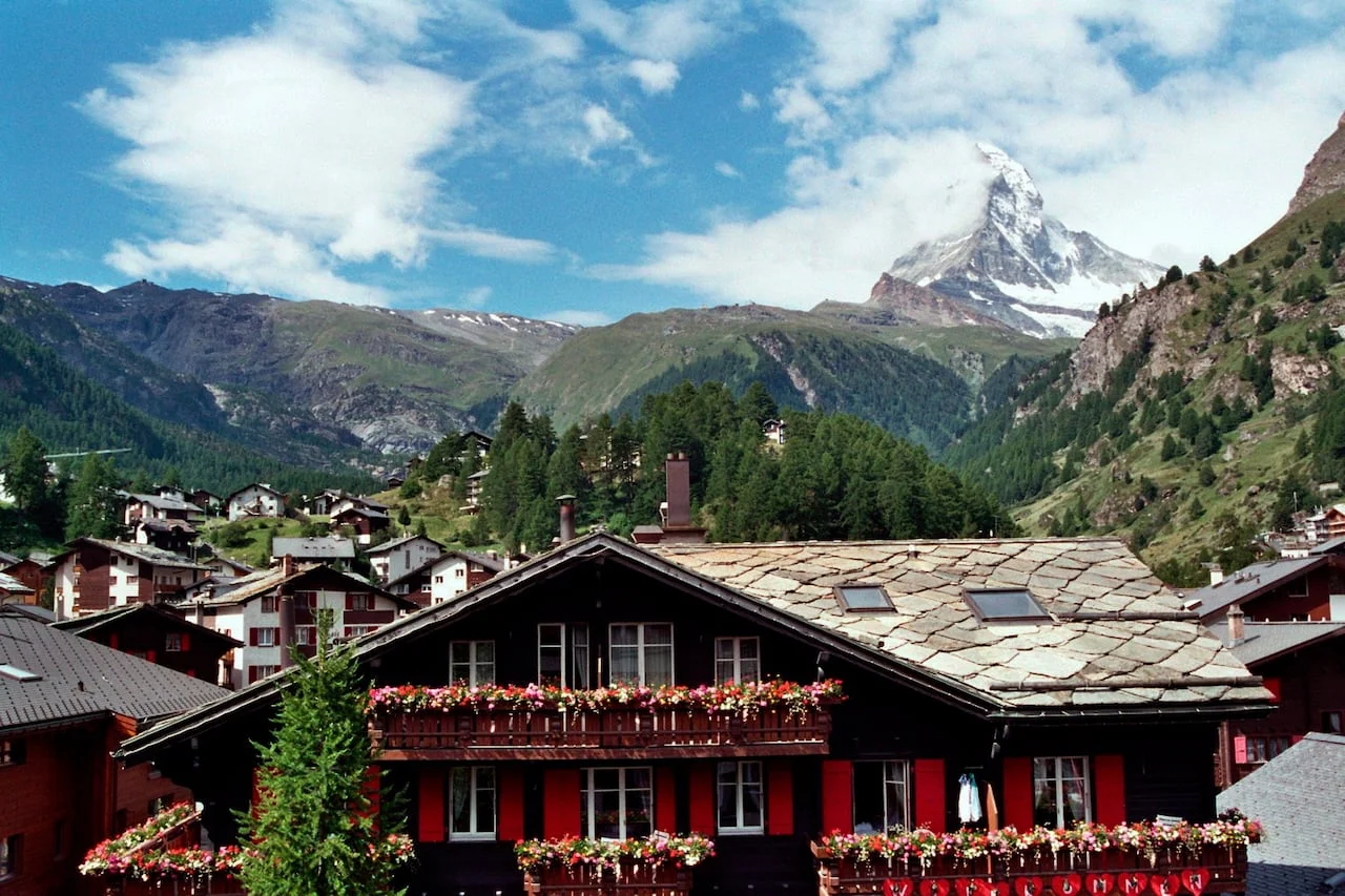 Big mountain with a little village in the foreground.